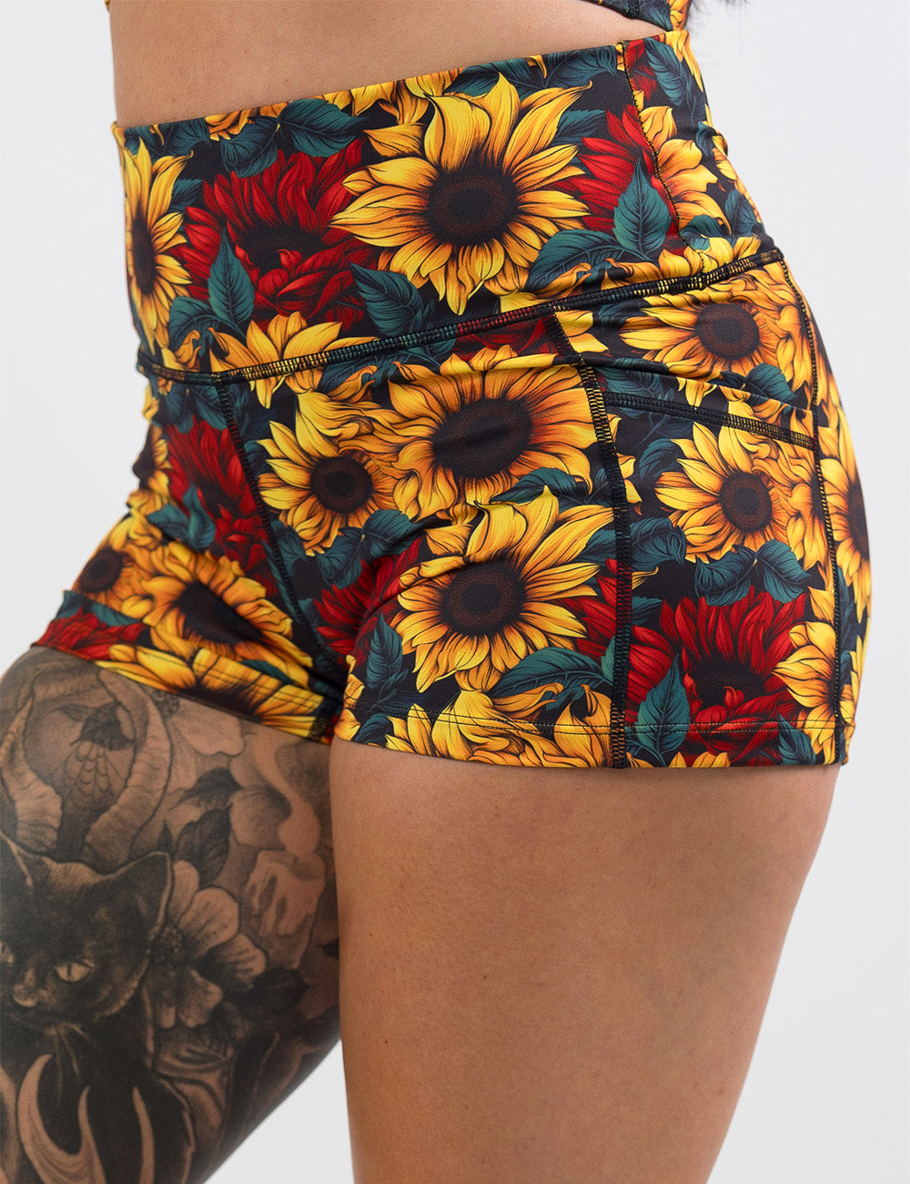front of the 2.5 inch sunflower with red flowers shorts against a white background