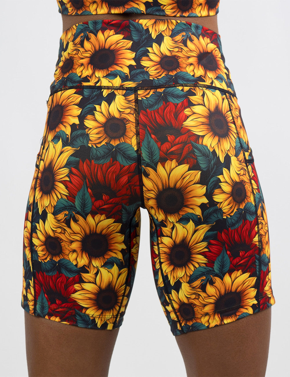 back of the 7 inch sunflower with red flowers shorts against a white background