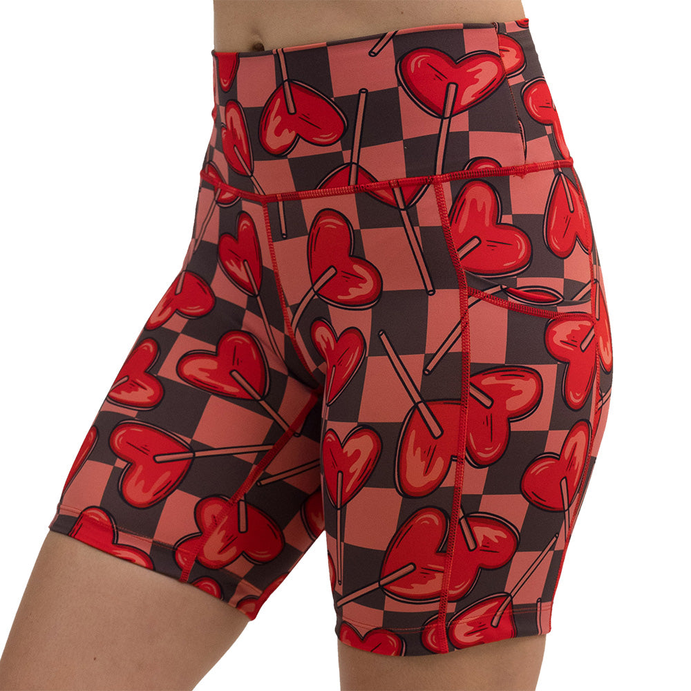 heart lollypops on a checker board pattern 7 inch shorts facing the front against a white background