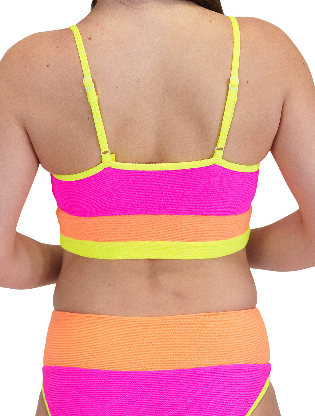 model wearing the pink, orange and yellow bathing suit