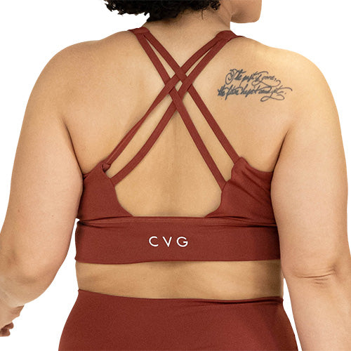 back of solid rust colored sports bra