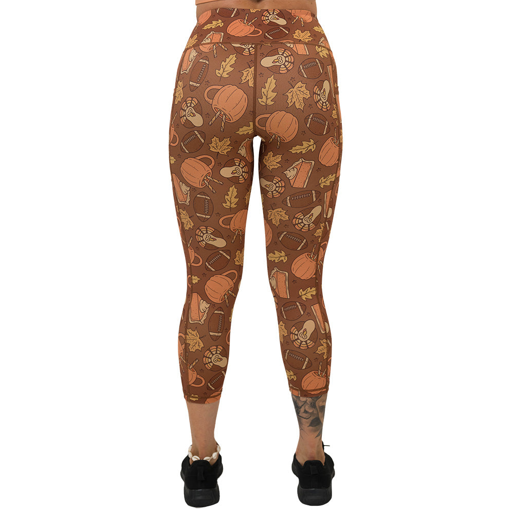 back of the leggings with pumpkins, leaves, and football
