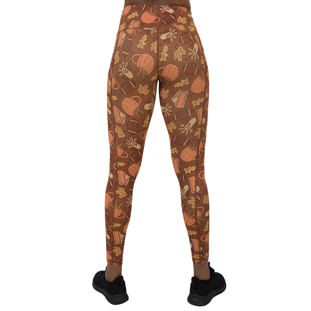 back of the leggings with pumpkins, leaves, and football