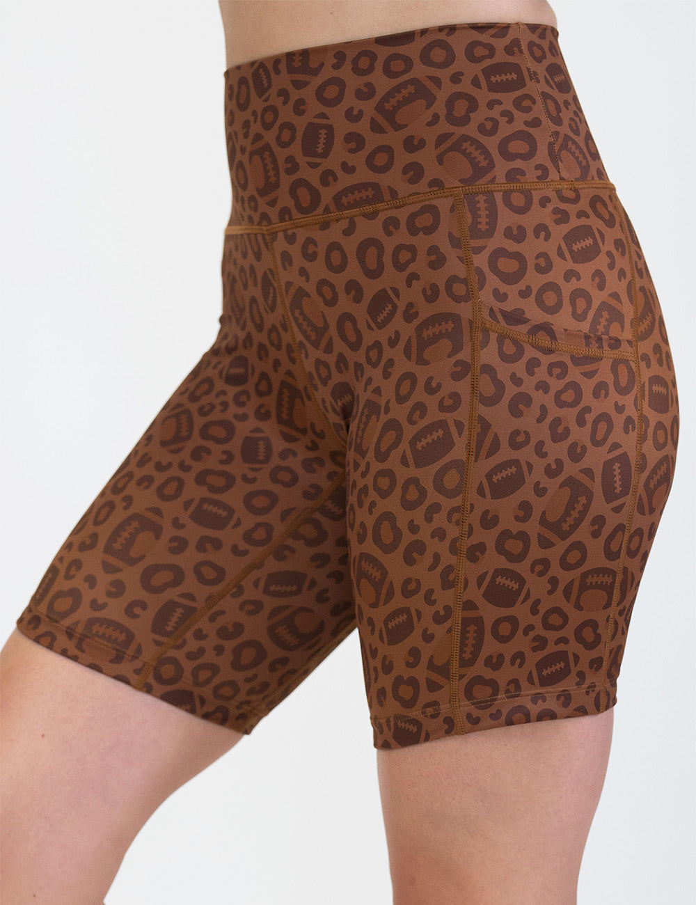 front of the 7 inch football themed brown leopard print shorts against a white background