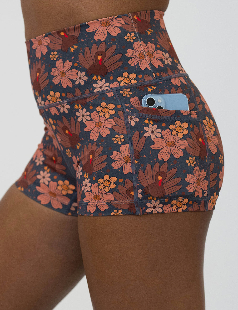 close up of the turkeys over a blue background 2.5 inch shorts with a phone in its pocket