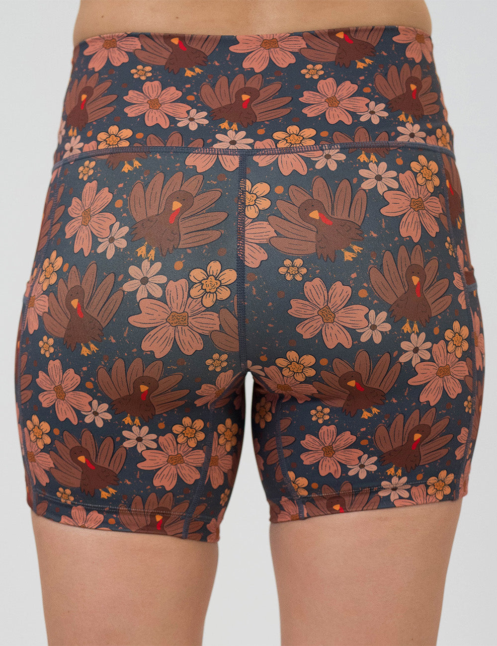 back of the 5 inch turkeys over a blue background shorts against a white background