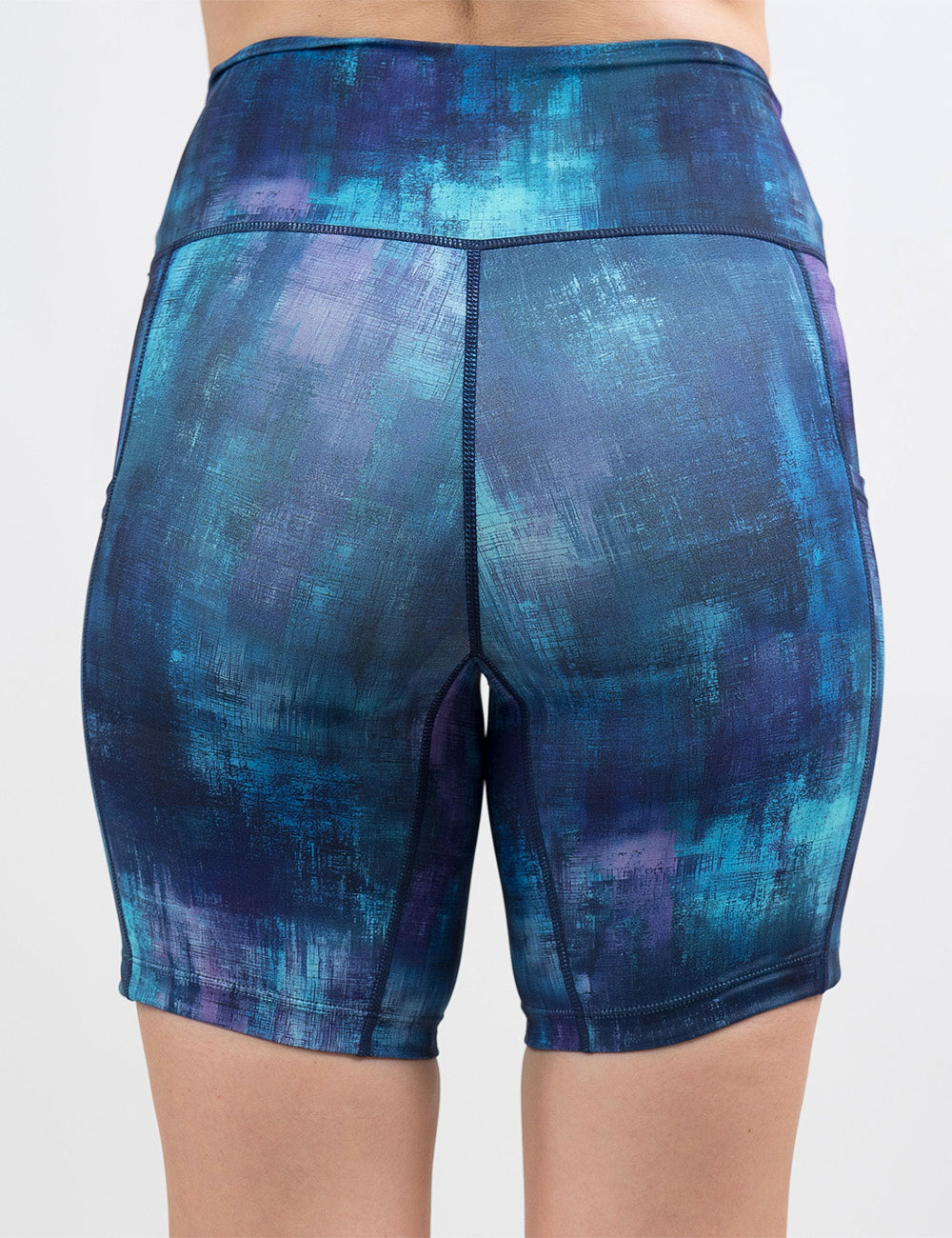 back of the 7 inch blue, teal, and purple grunge concrete pattern shorts against a white background