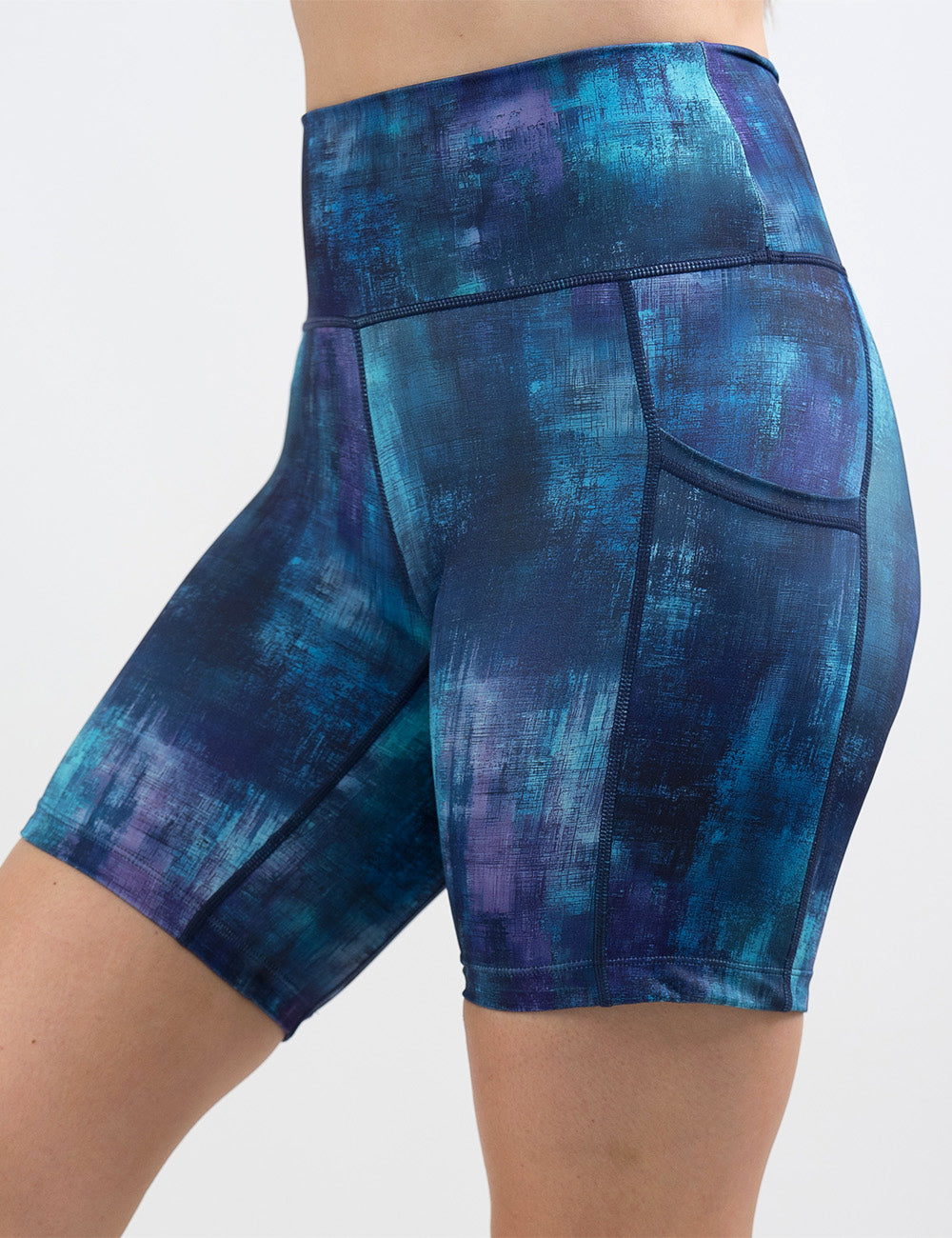 front of the blue, teal, and purple grunge concrete pattern 7 inch shorts against a white background