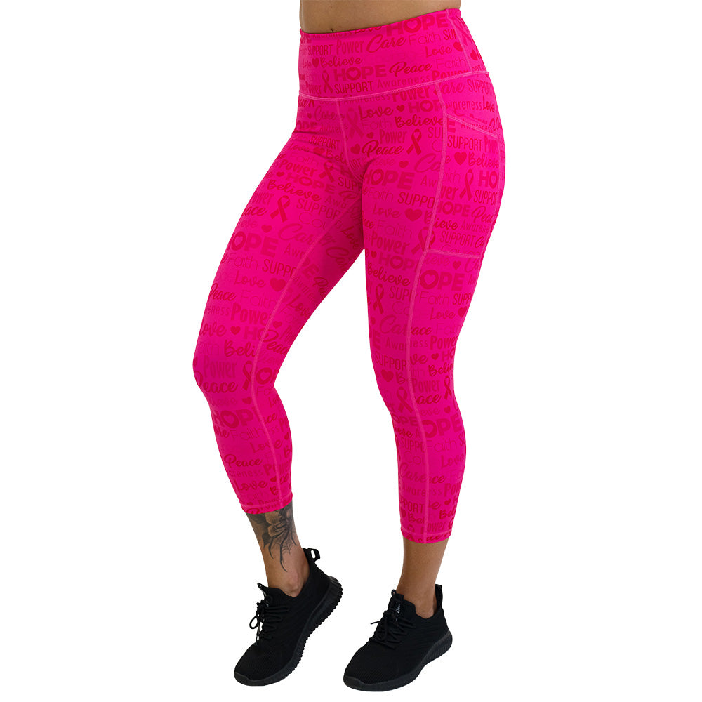 Pink leggings with motivational text and breast cancer awareness ribbons