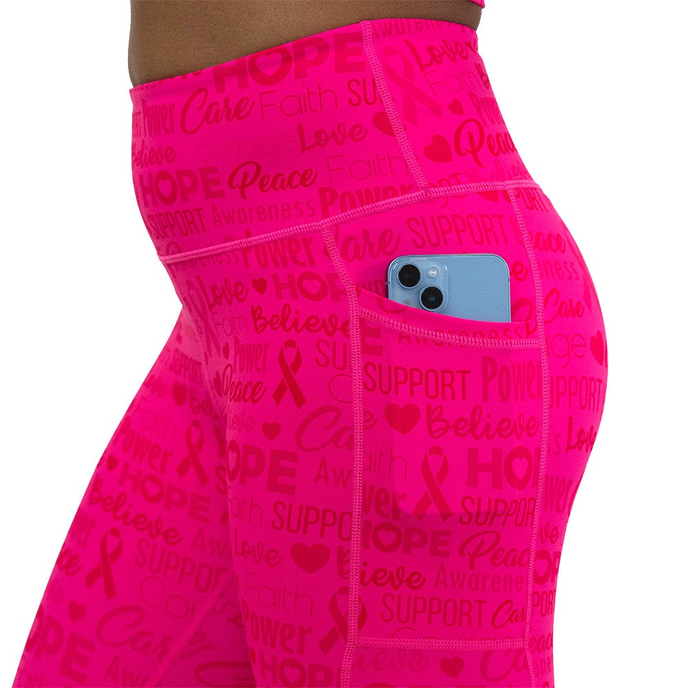 Pink leggings with motivational text and breast cancer awareness ribbons