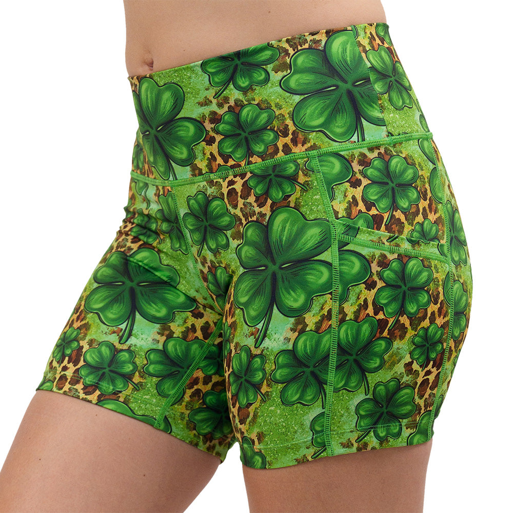 clover pattern against a cheetah print and green background 5 inch shorts facing the front against a white background