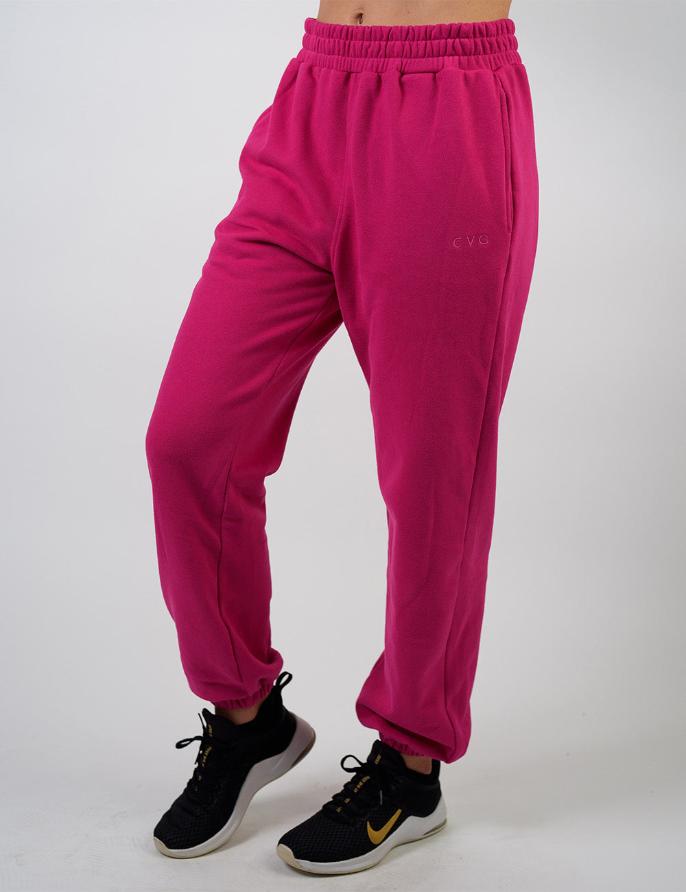 front of the pink sweatpants with a subtle CVG logo