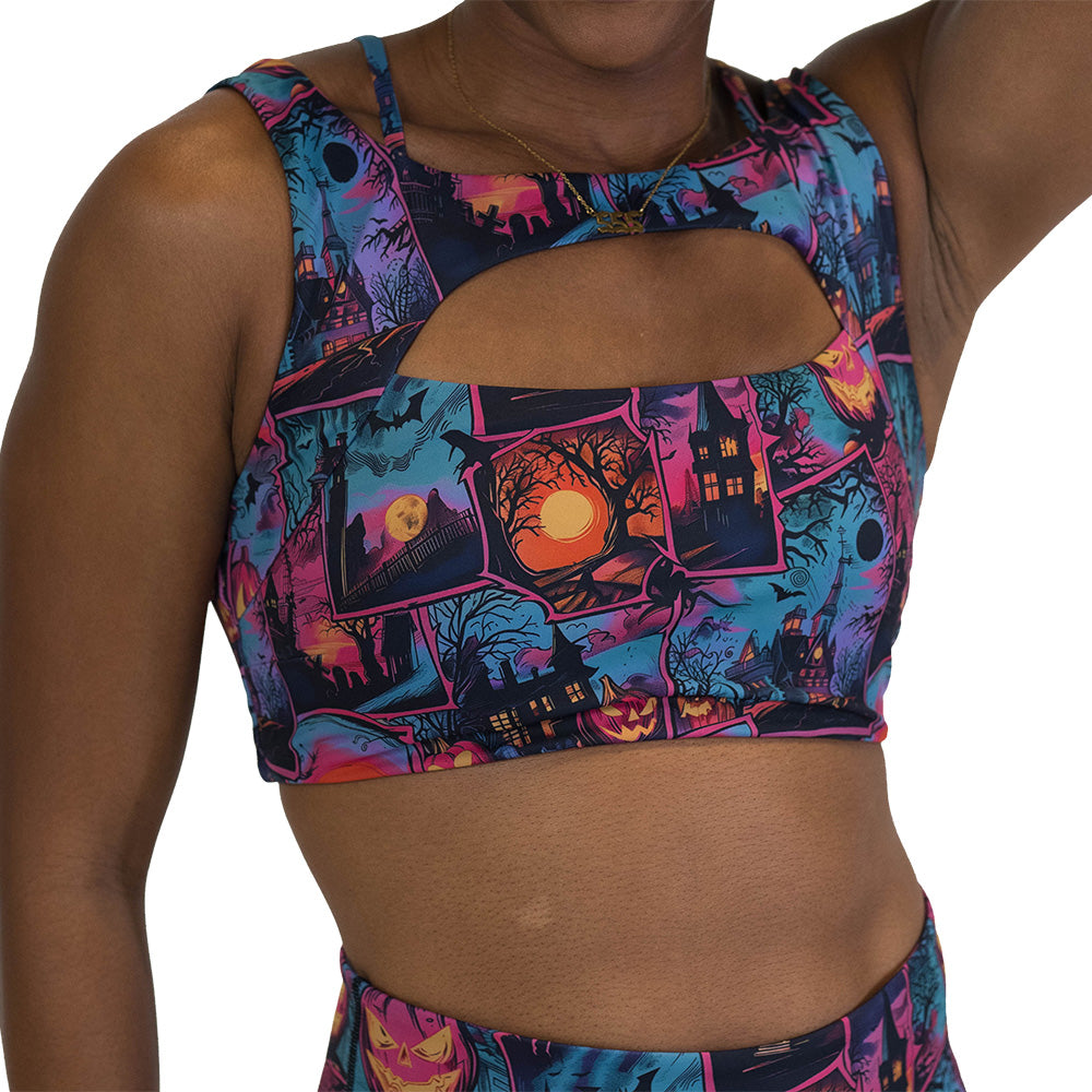 Person wearing a colorful Halloween-themed sports bra