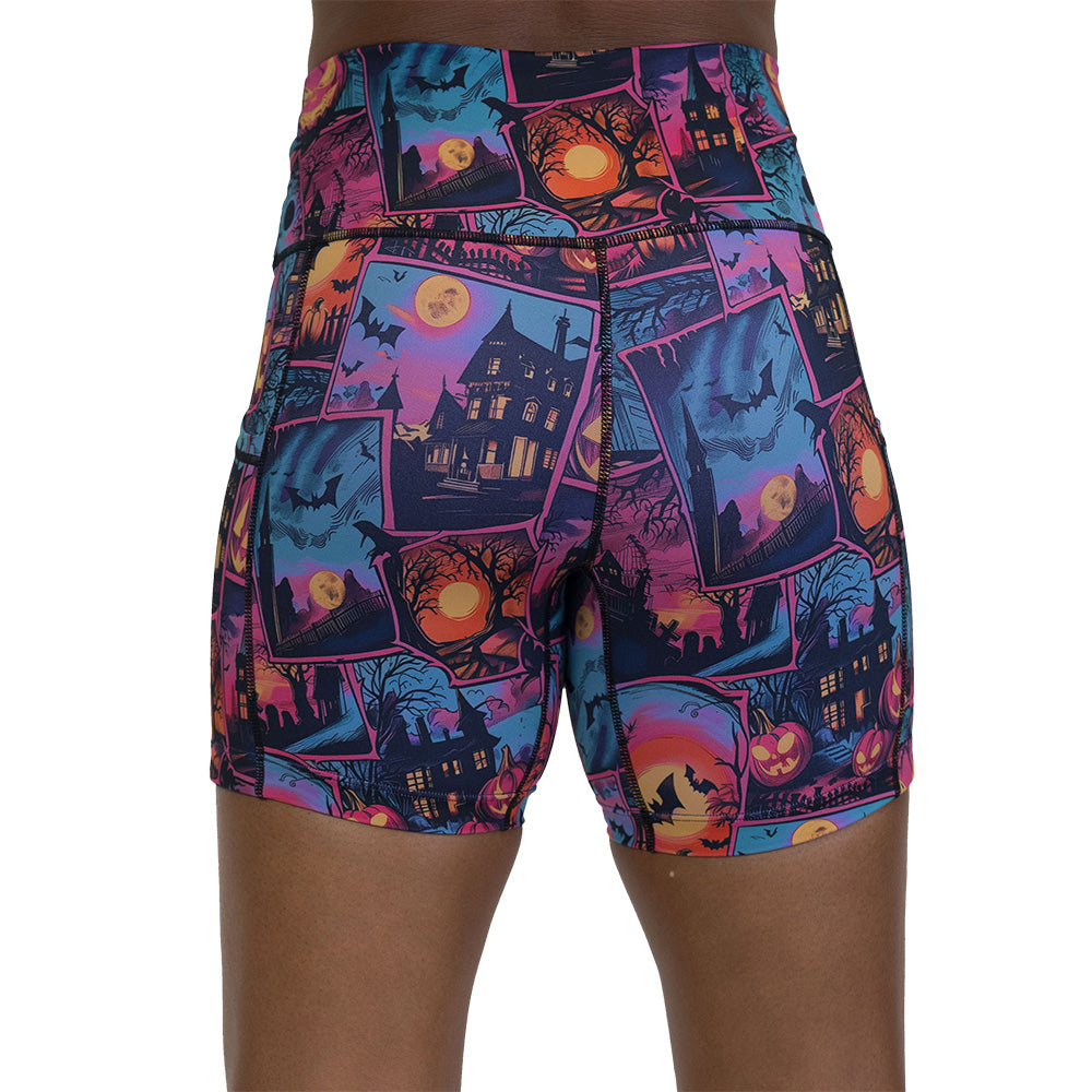 back of the colorful Halloween-themed shorts with pumpkins, ghosts, and bats