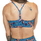 back of blue voodoo doll print sports bra