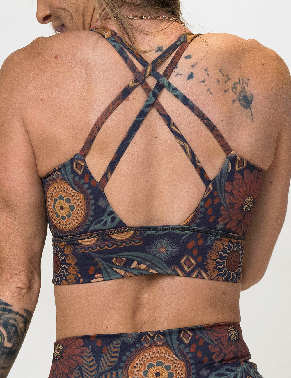 back of the paisley flowers bra against a white background