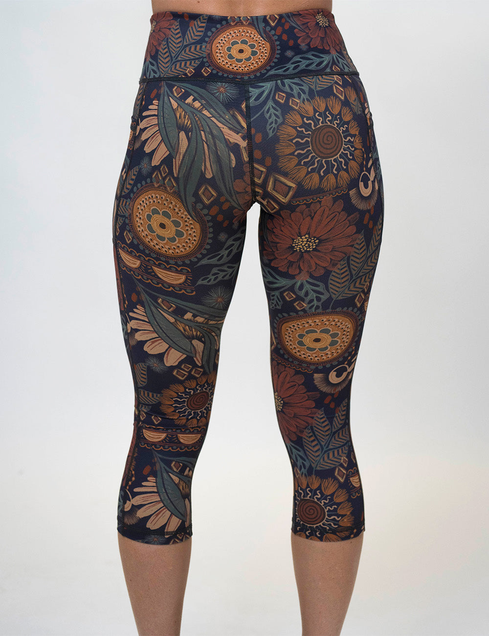 back of the capri paisley flowers leggings against a white background