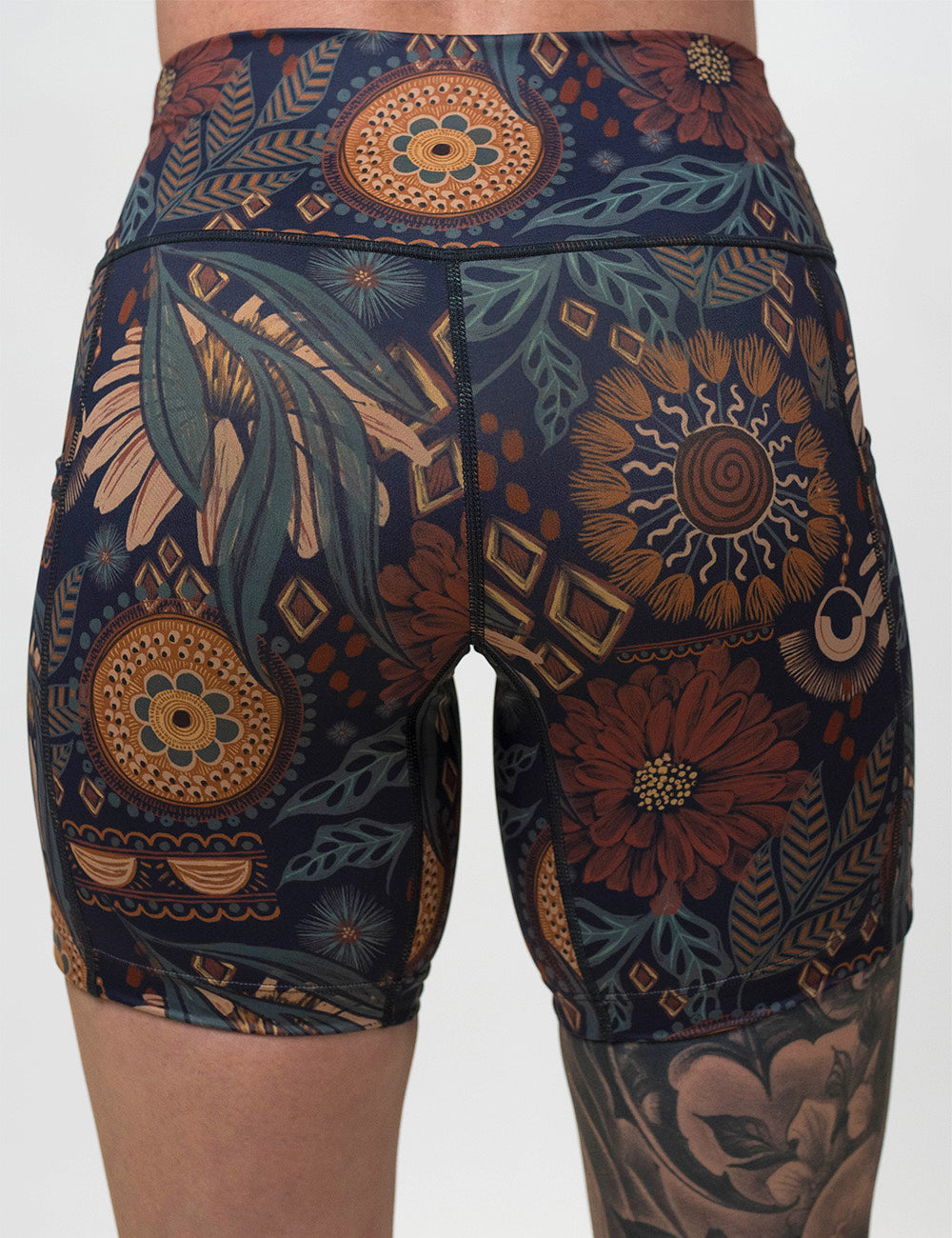 back of the 7 inch paisley flowers shorts against a white background