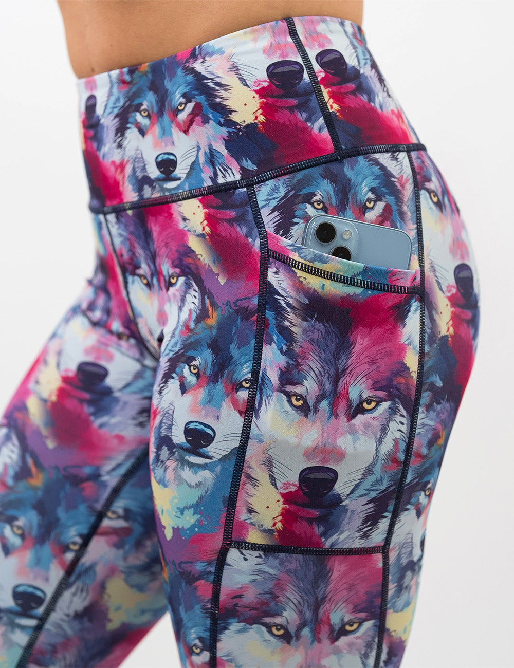 close up of the red, blue, yellow, and white watercolor style wolves with a phone in its pocket against a white background