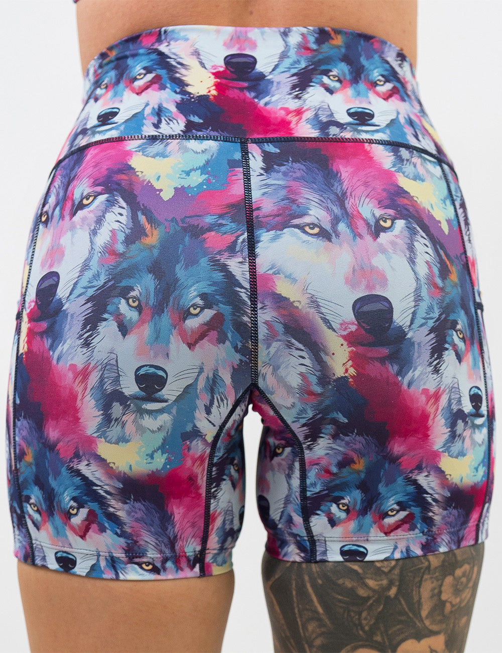 back of the 5 inch red, white, blue, and yellow watercolor style wolves against a white background