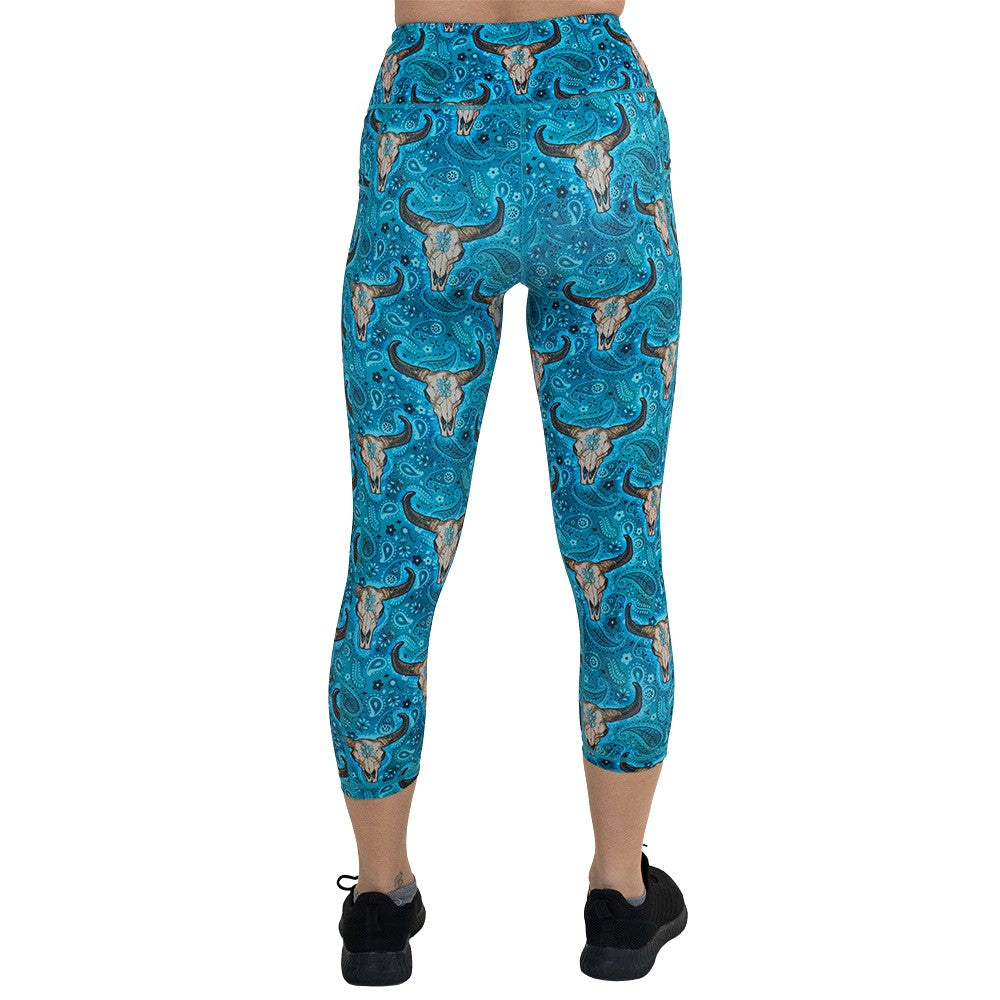 back of the capri length teal cow skull print leggings