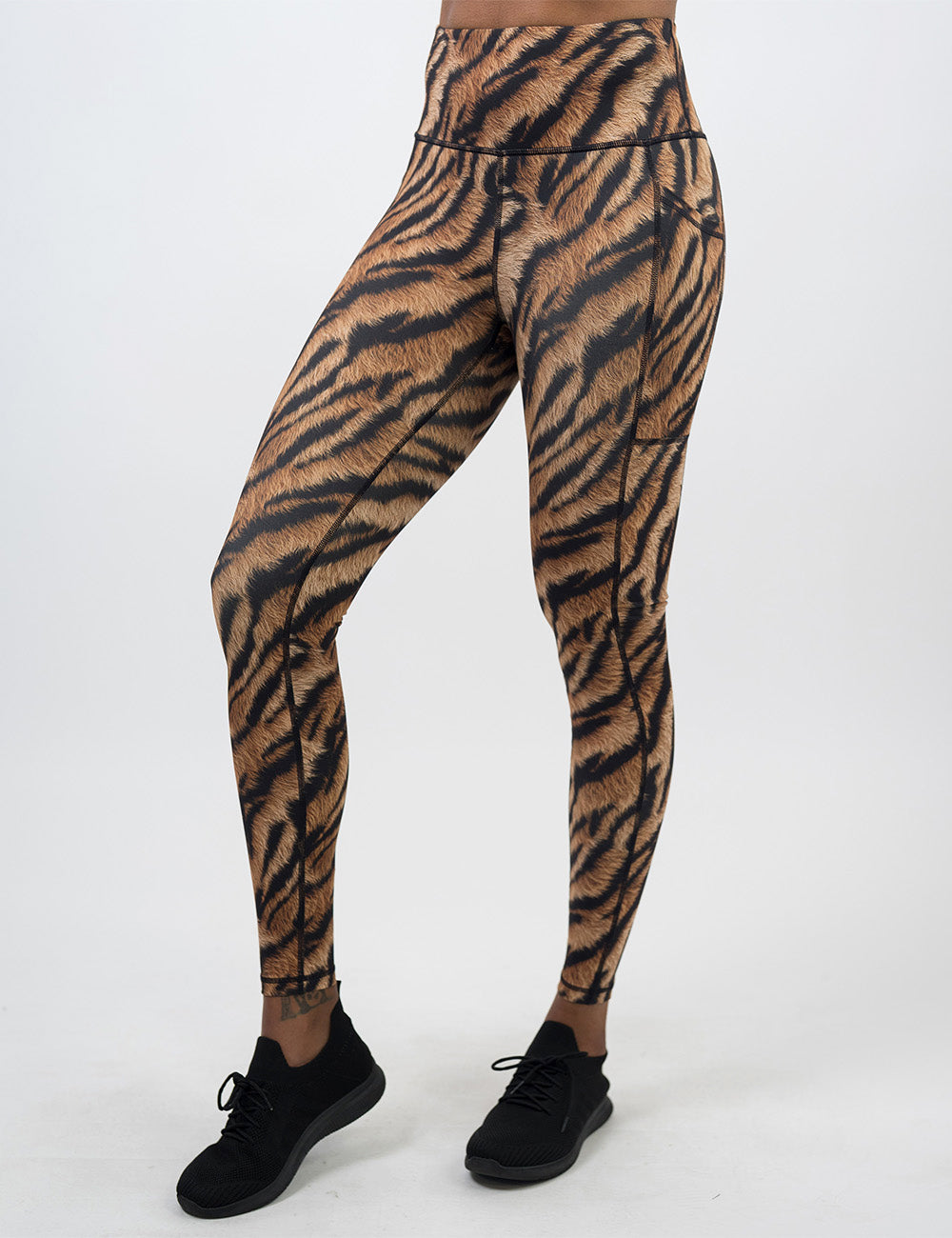 front of the full length tiger print leggings against a white background