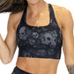 front of grey and black skull and butterfly bra