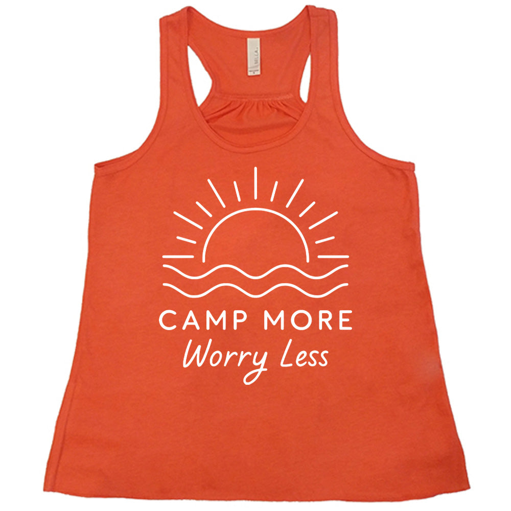 coral flowy tank with the words "camp more worry less" on it, under the line art graphic of a large sun over water