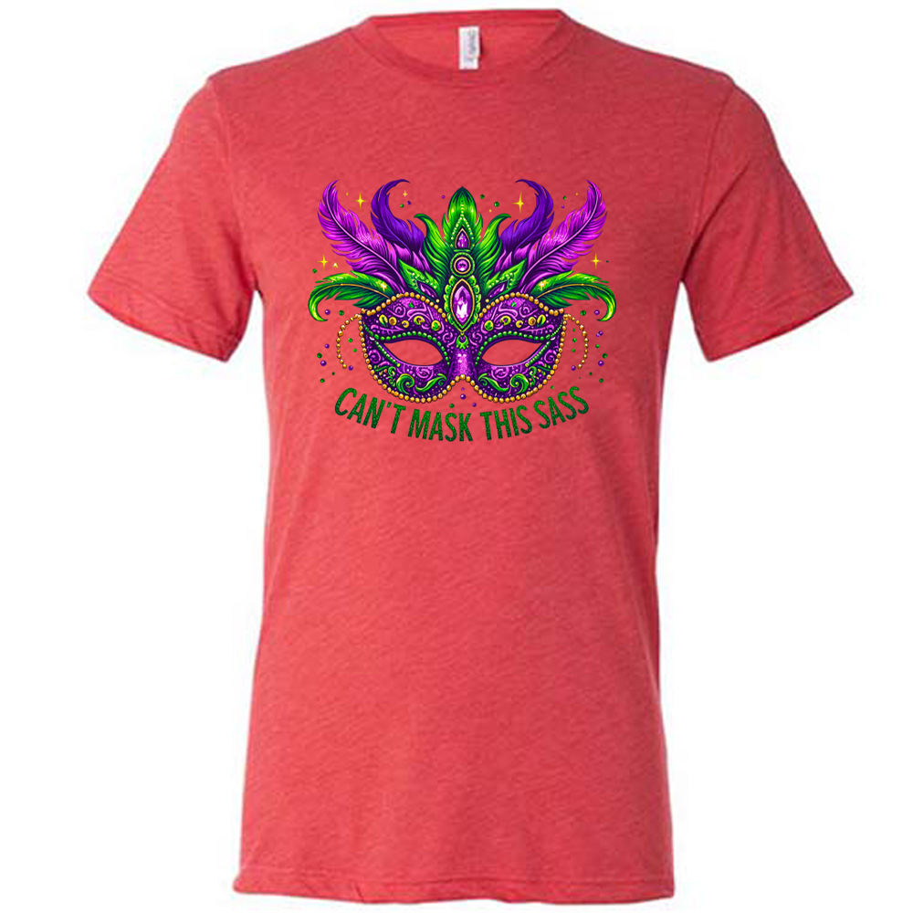 red unisex tee with the graphic of a fancy, feathered and bejeweled, and colorful mardi gras mask, and words underneath saying "can't mask this sass"