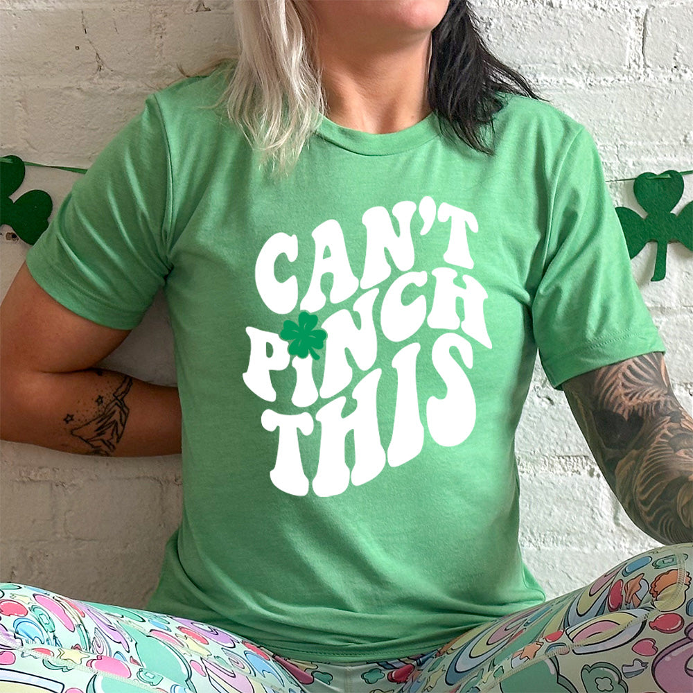 lucky green unisex tee with the words "can't pinch this" with a clover above the "i" of "pinch"