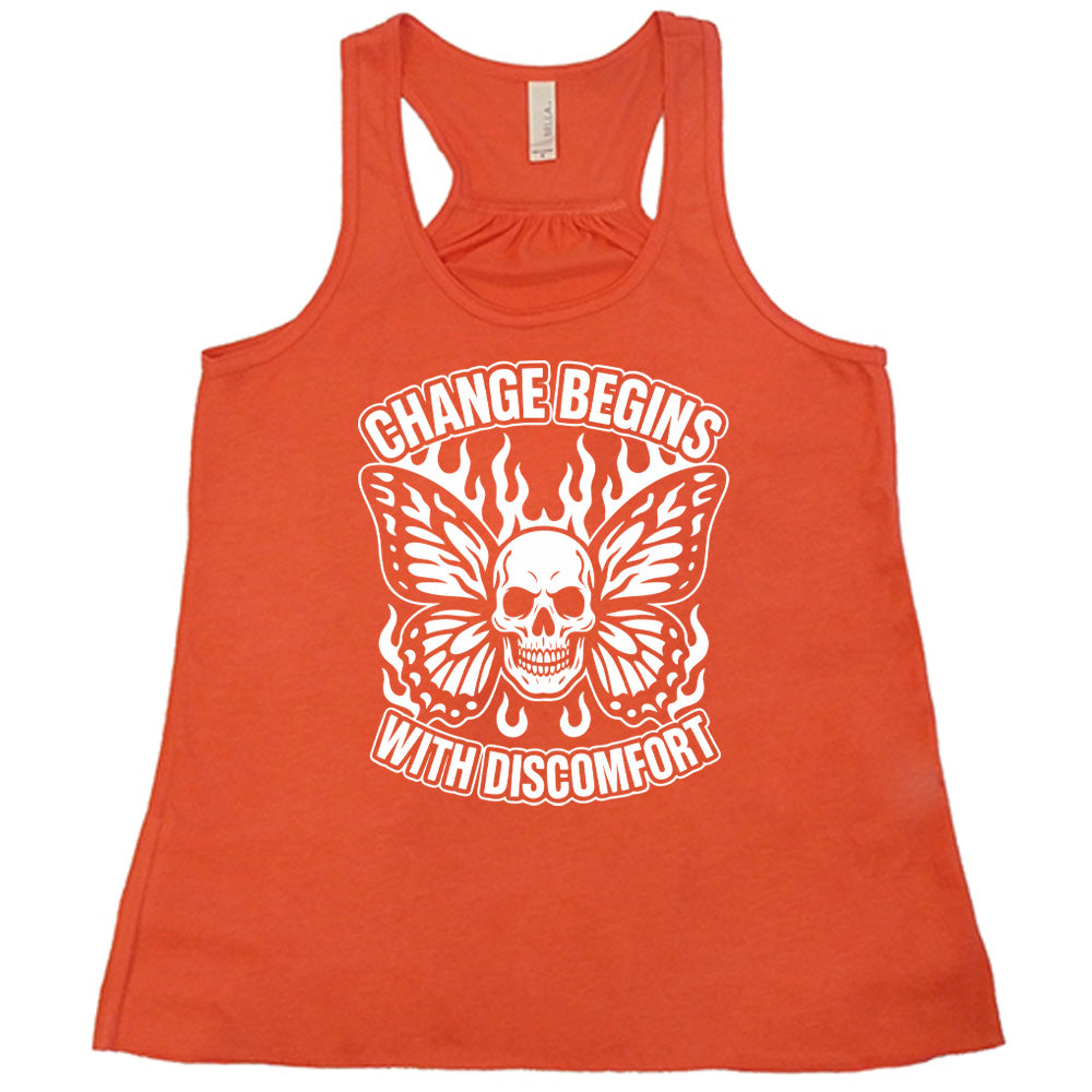 coral flowy tank with the words "change begins with discomfort" surrounding the graphic of a skull with flaming butterfly wings 