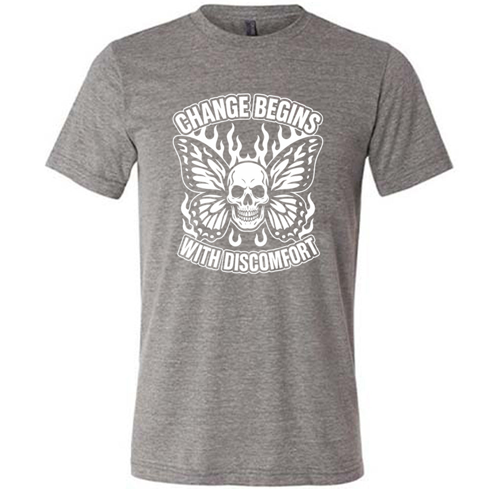 grey unisex tee with the words "change begins with discomfort" surrounding the graphic of a skull with flaming butterfly wings 