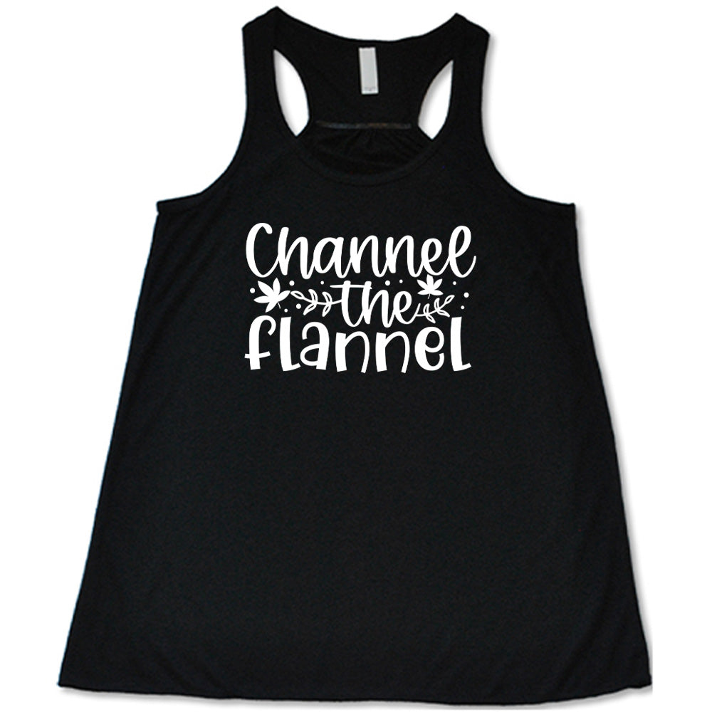 Black colored flowy tank with fall leaf graphic on it that says "Channel The Flannel"