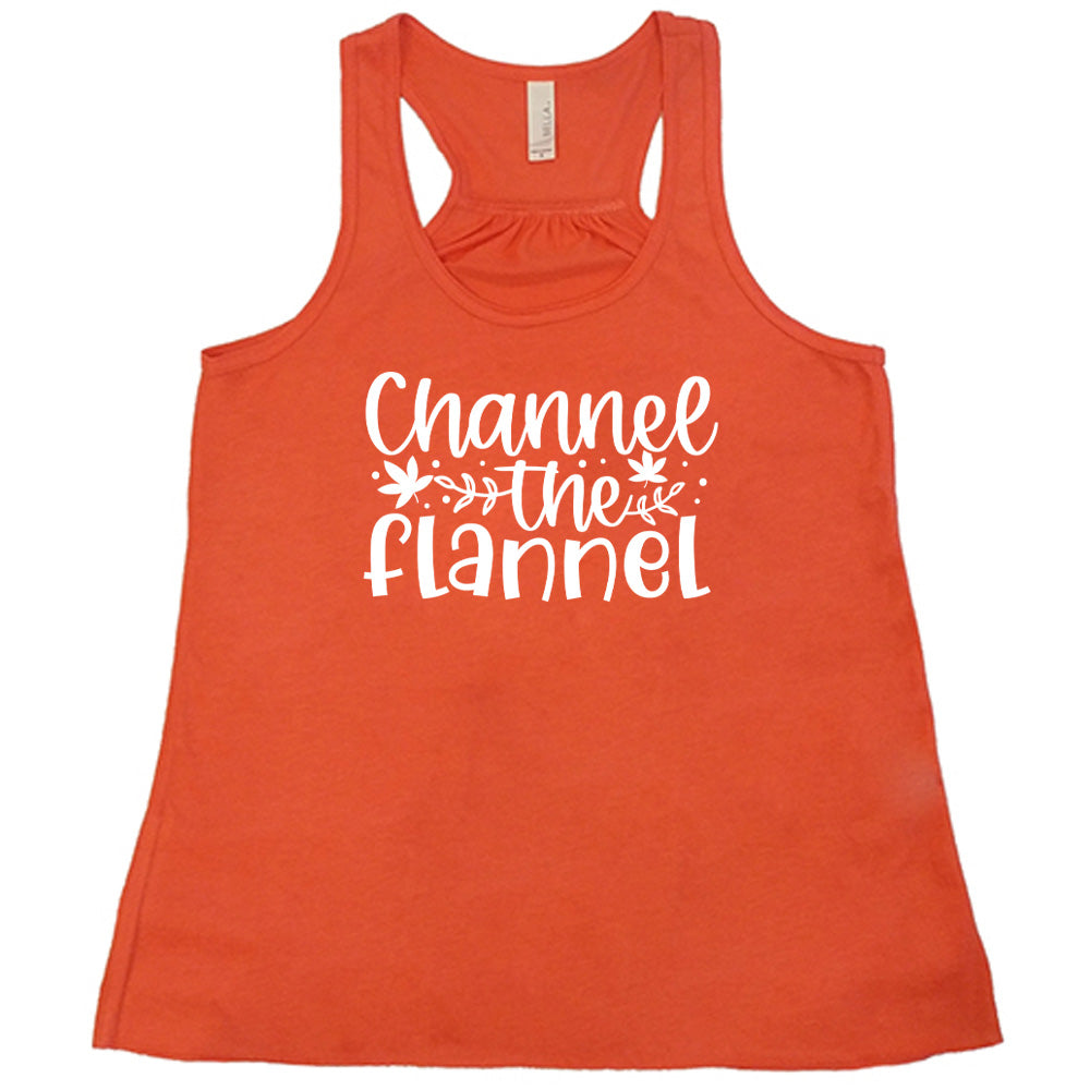 Coral colored flowy tank with fall leaf graphic on it that says "Channel The Flannel"