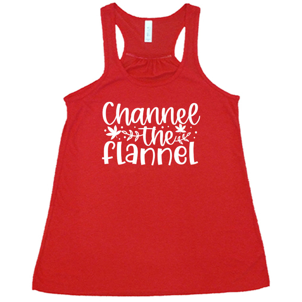 Red colored flowy tank with fall leaf graphic on it that says "Channel The Flannel"
