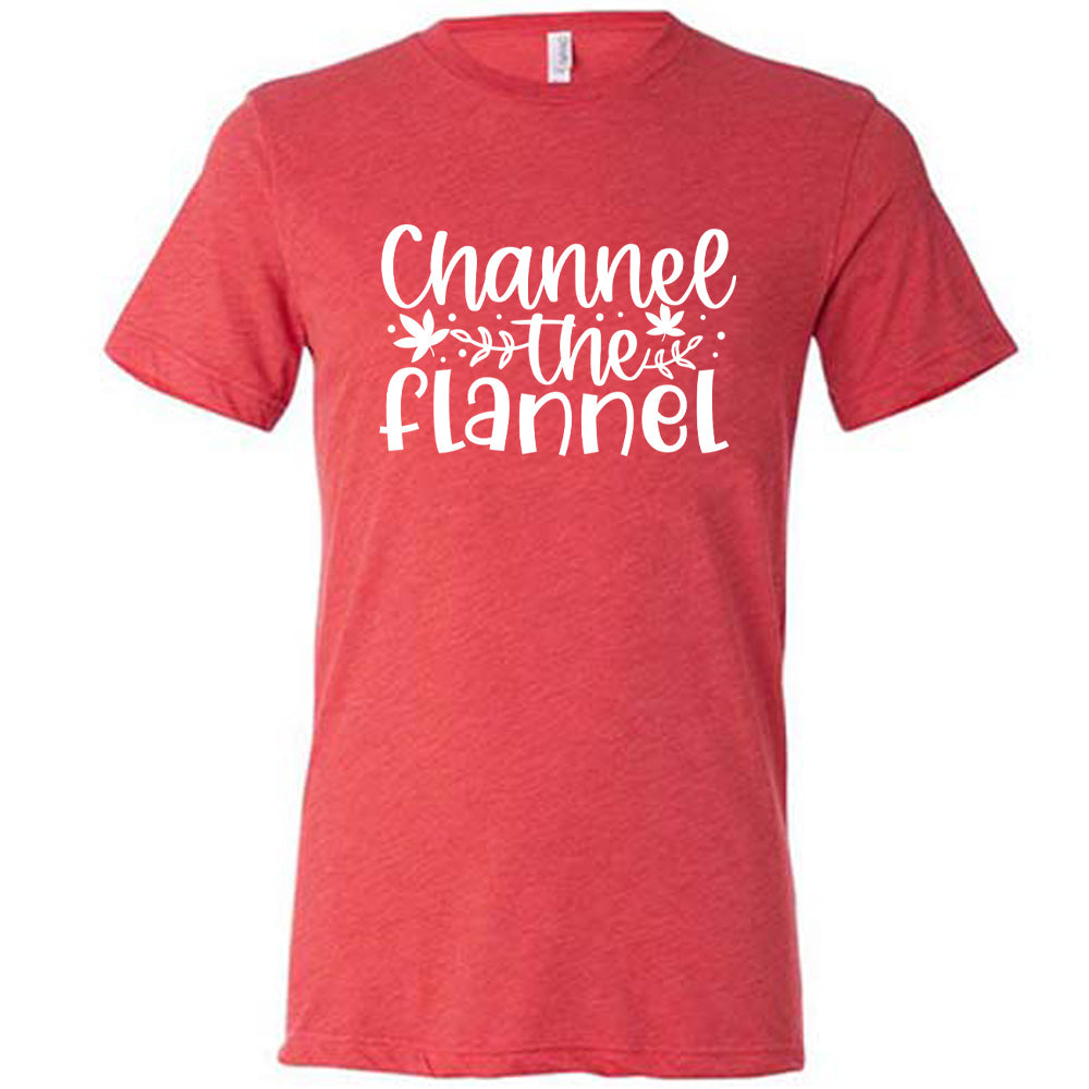 Red colored shirt with fall leaf graphic on it that says "Channel The Flannel"