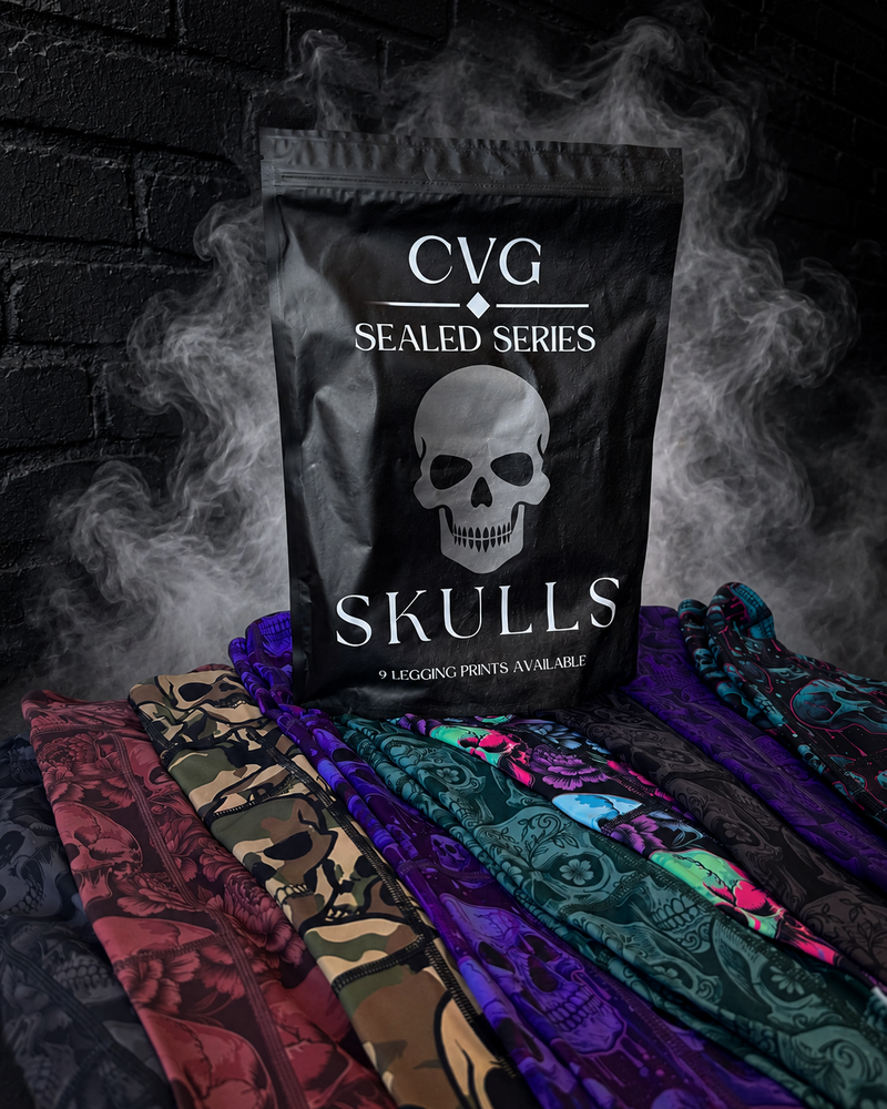 Black bag labeled 'CVG Sealed Series Skulls' with colorful leggings underneath on a dark background.