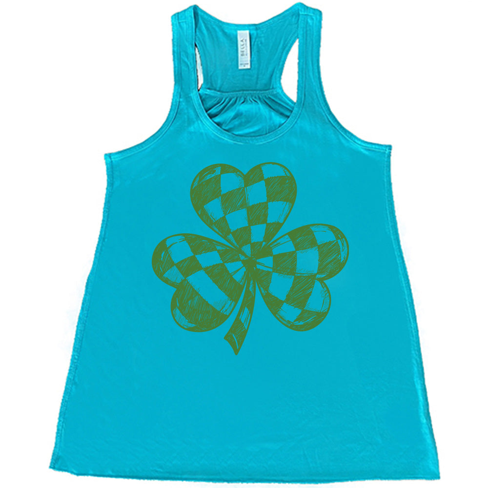 teal flowy tank with the large graphic of a shamrock that is checkered on the inside