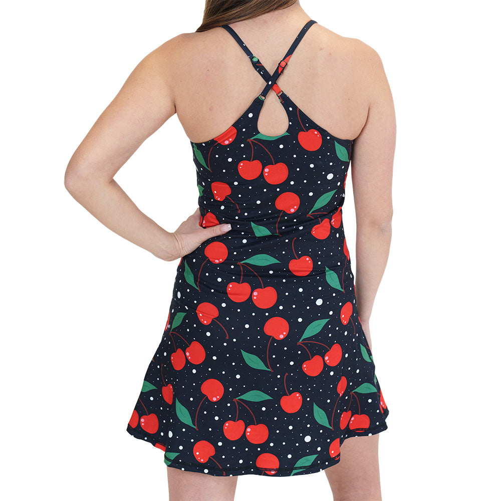 back of the black dress with a cherry pattern on it
