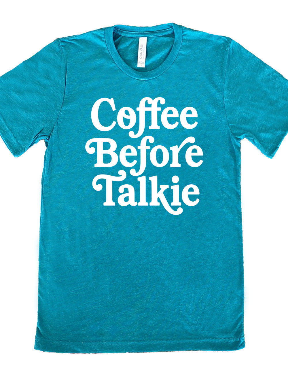 teal unisex tee with words on it saying "coffee before talkie"