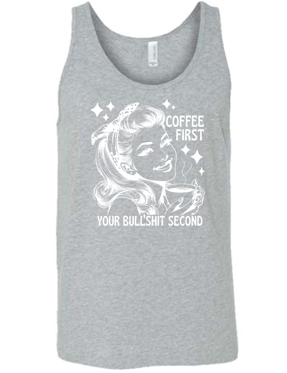 grey unisex tank with the graphic of a woman happily holding a mug of steaming coffee, with the words "coffee first" (next to her face) and "your bullshit second" underneath, and a few stars around her