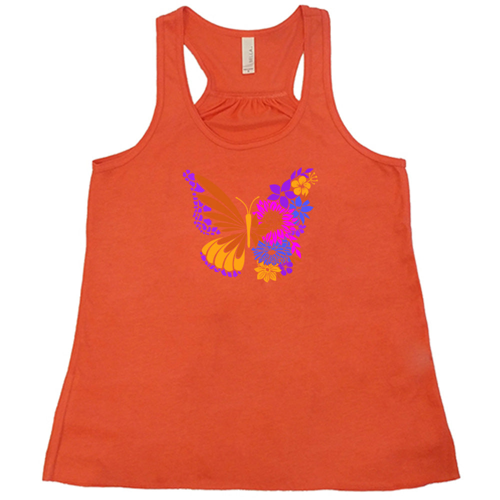 Coral colored flowy tank with a floral butterfly graphic on it