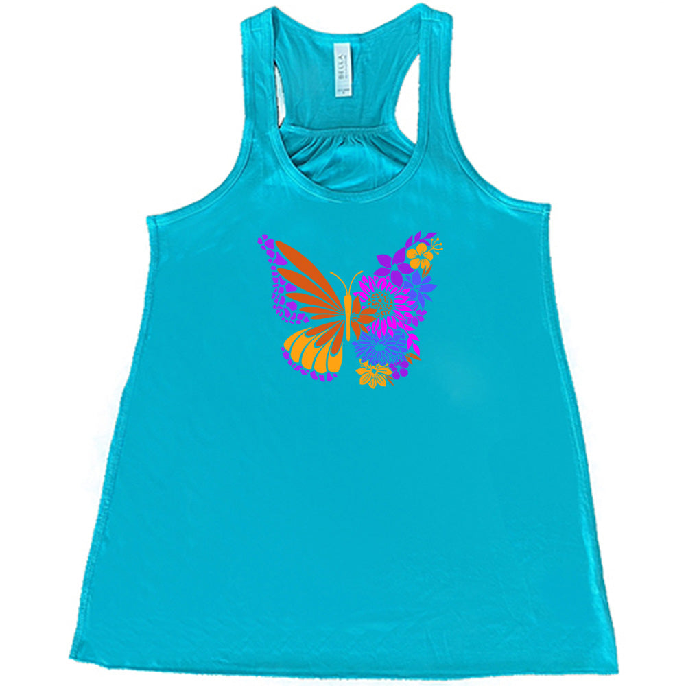 Teal colored flowy tank with a floral butterfly graphic on it