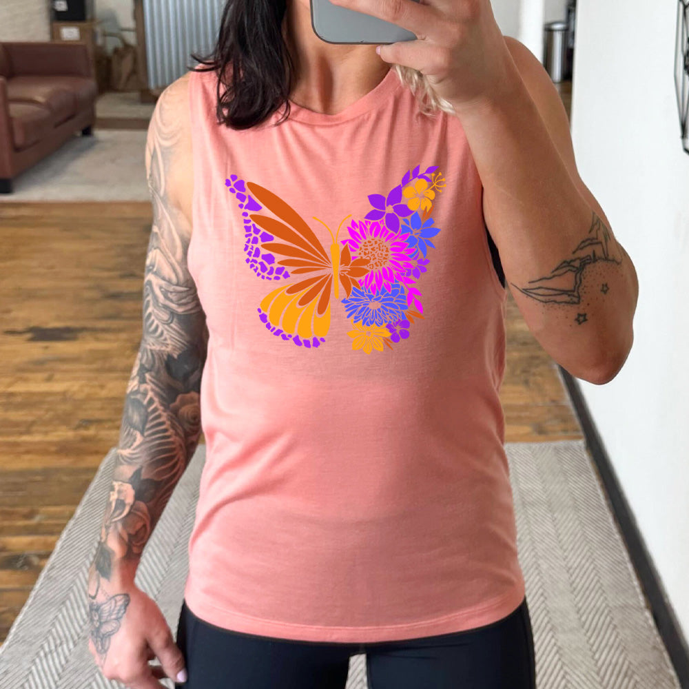 peach muscle tank with a floral butterfly graphic on it