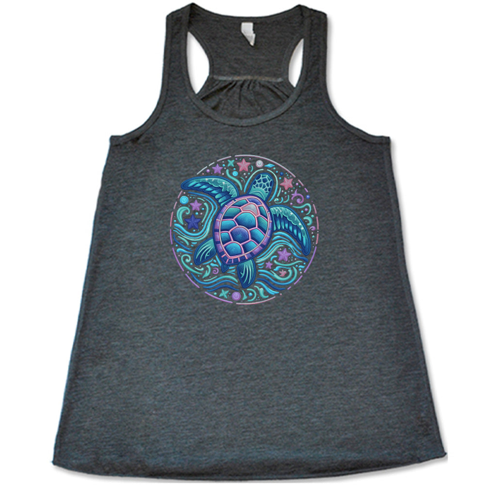 Grey colored flowy tank with a colorful turtle graphic on it