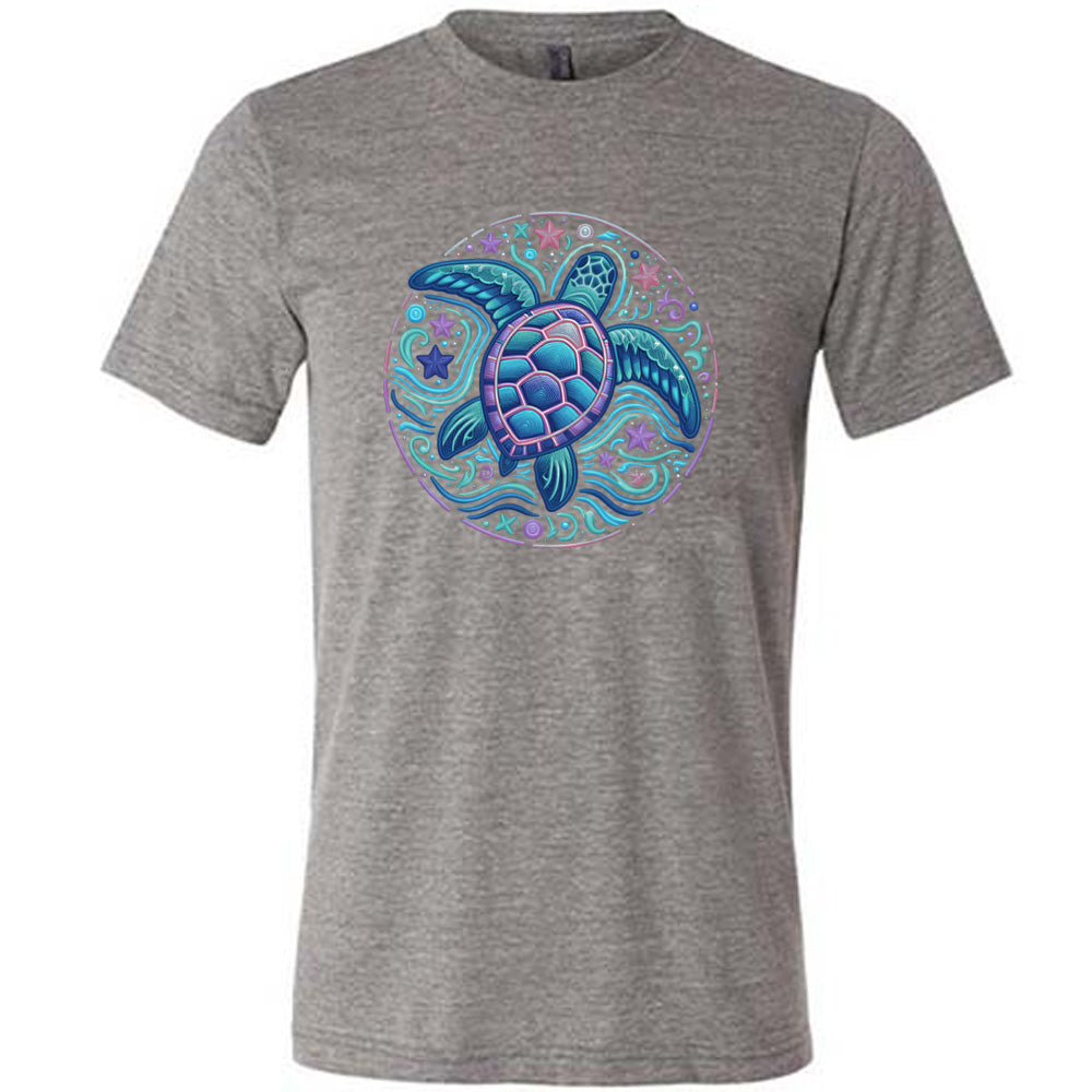 Grey colored shirt with a colorful turtle graphic on it