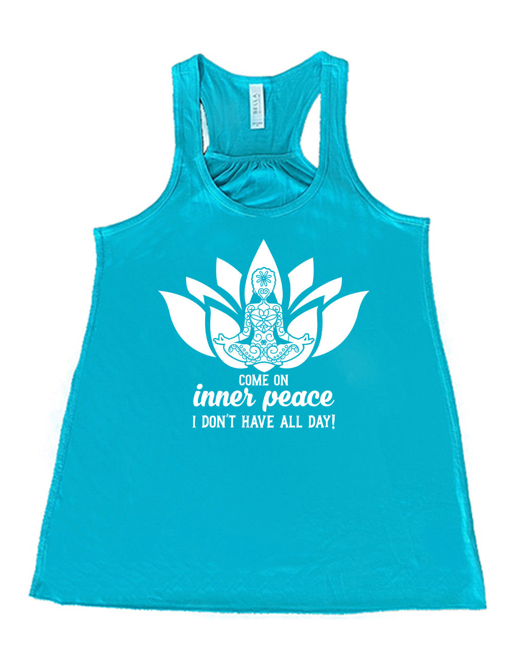teal flowy racerback tank with the graphic of a patterned person's silhouette doing a seated yoga pose, sitting in a lotus shape, with the words underneath saying "come on inner peace I don't have all day!