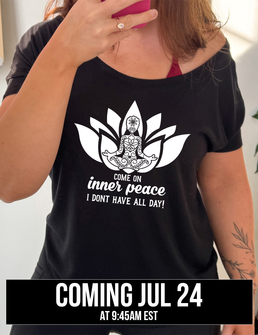 black slouchy tee with the graphic of a patterned person's silhouette doing a seated yoga pose, sitting in a lotus shape, with the words underneath saying "come on inner peace I don't have all day! coming july 24th