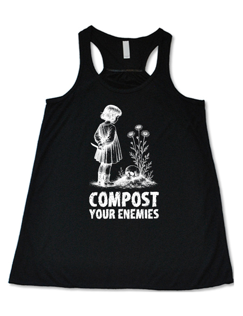 black flowy racerback tank with the graphic of a little bobbed-hair girl in a dress, holding a knife behind her back, looking down at a skull that rests on a little hill with tall flowers growing there, and the words underneath that say "compost your enemies"