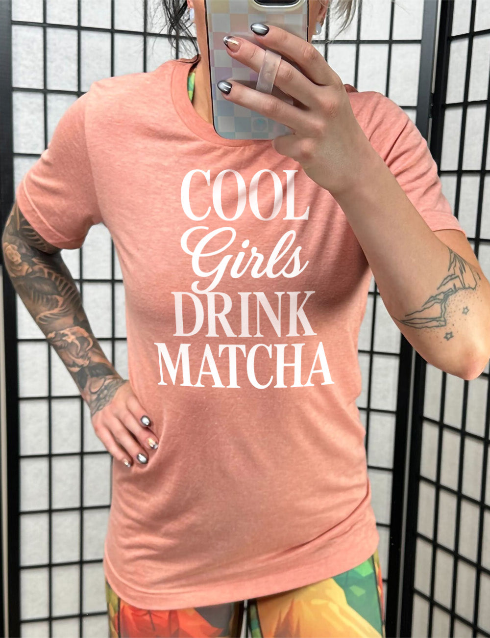 sunset unisex tee with the words on it saying "cool girls drink matcha"